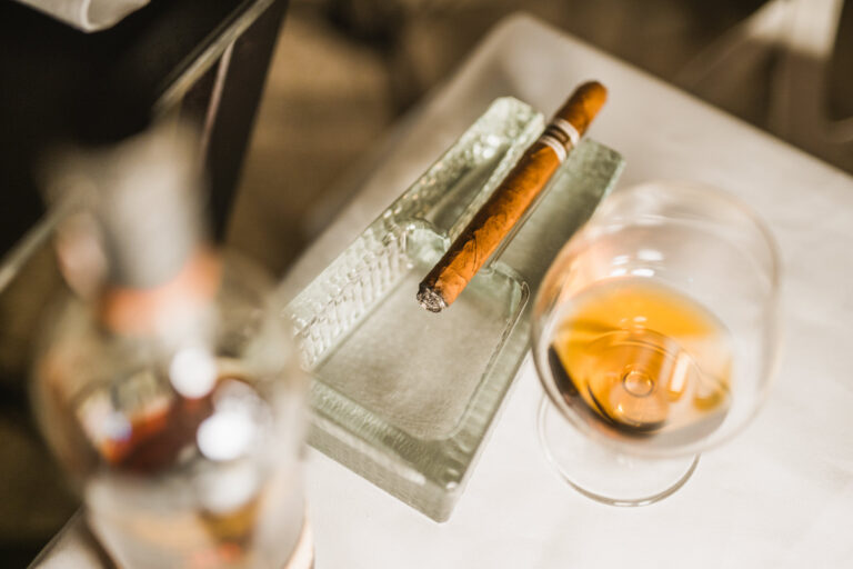 Cigarette with a glass of alcohol
