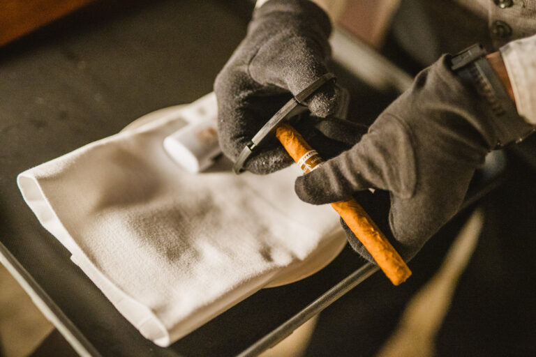 A professional serving a cigar