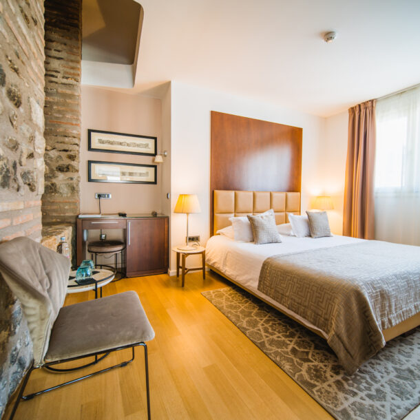 Superior double or twin room bed and old wall