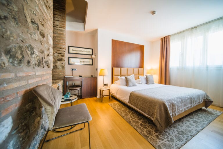 Superior double or twin room bed and old wall