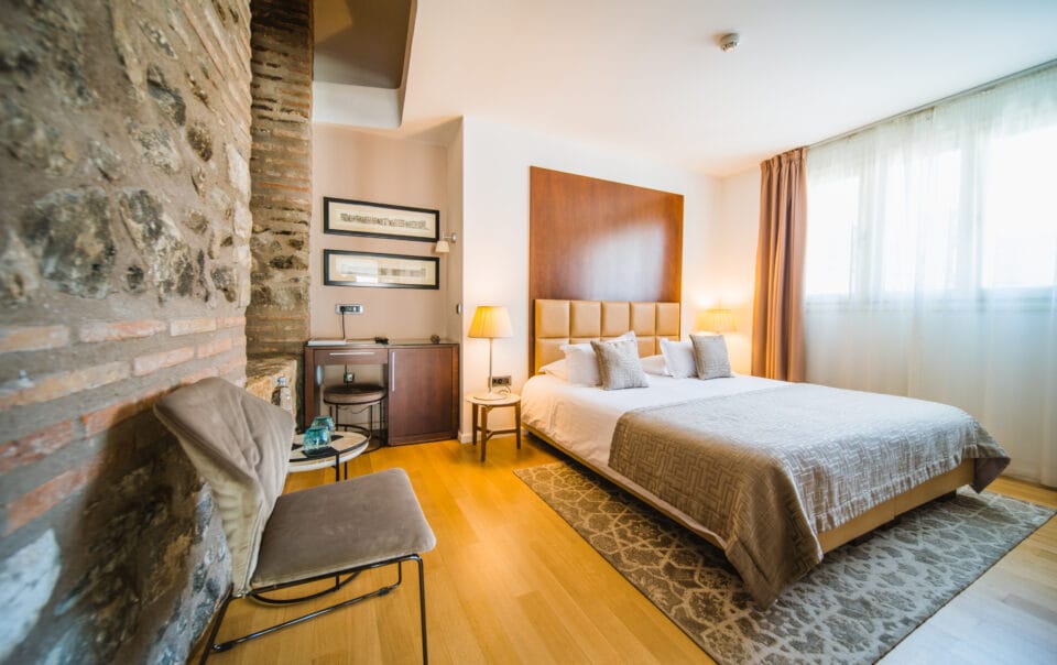 Superior double or twin room bed and old wall