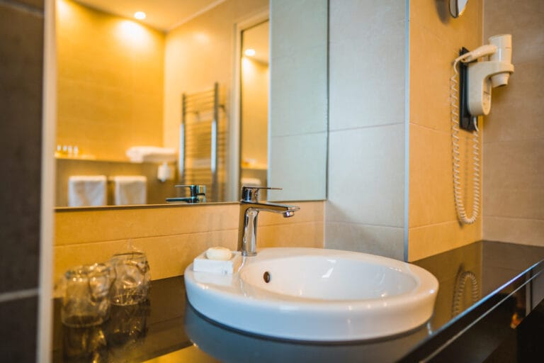 Junior suite bathroom sink with utilities