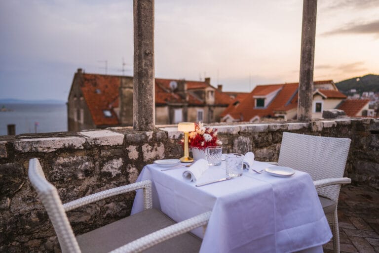 Gourmet meal for two with a view of the rooftops