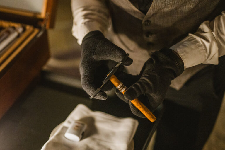 A professional serving a cigar