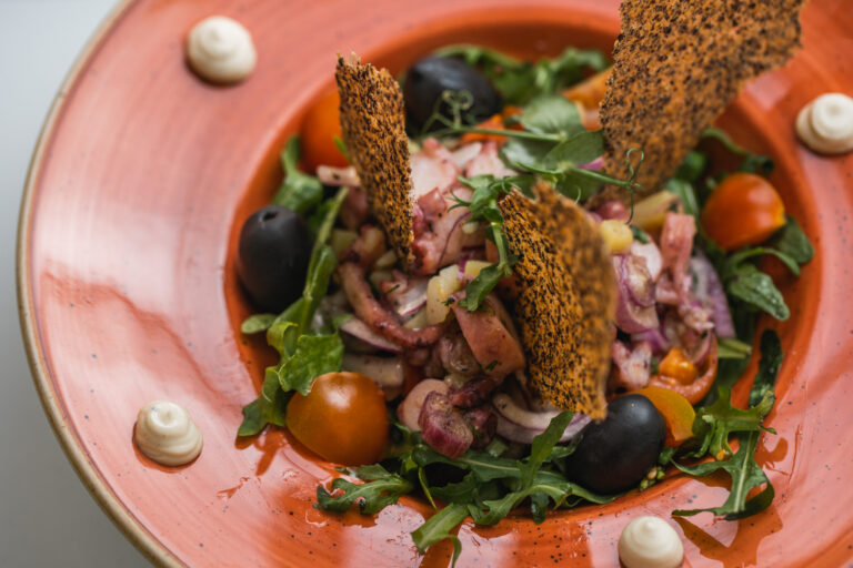 Octopus salad with plate decor
