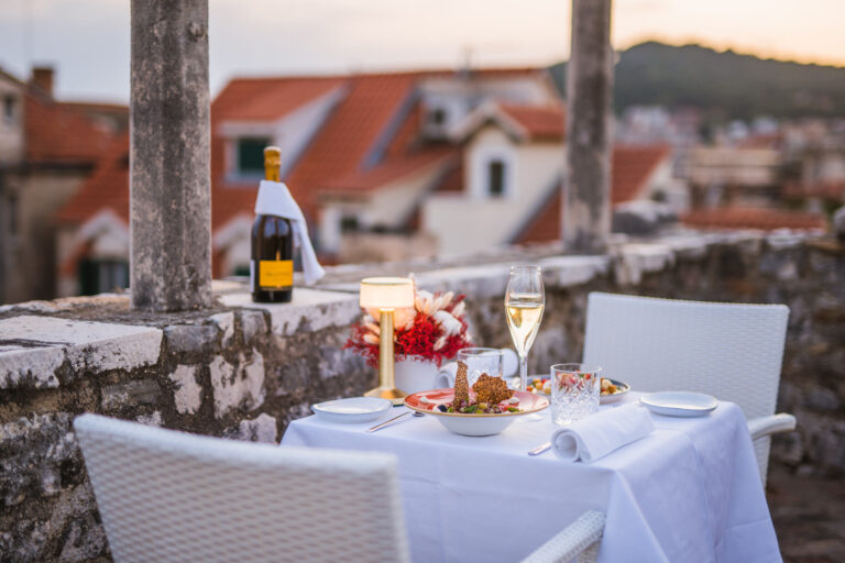 Hotel terrace dinner for two on top of the hotel with a view of the city
